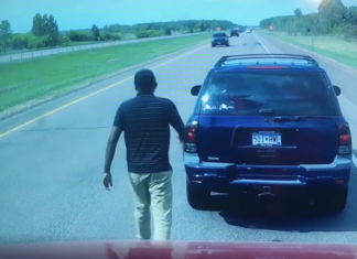 A trucker encounters a stuck motorist on the roadway in front of him.