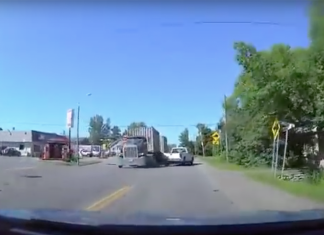 VIDEO: Oblivious pickup driver is just a hair away from being obliterated by a semi truck