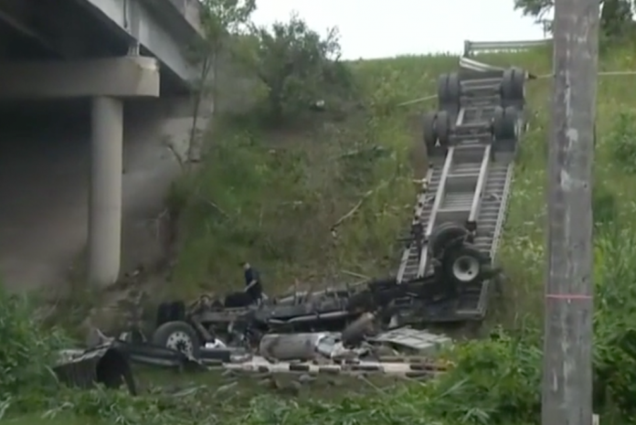 Semi truck driver miraculously survives after flipping big rig off overpass Semi truck driver miraculously survives after flipping big rig off overpass