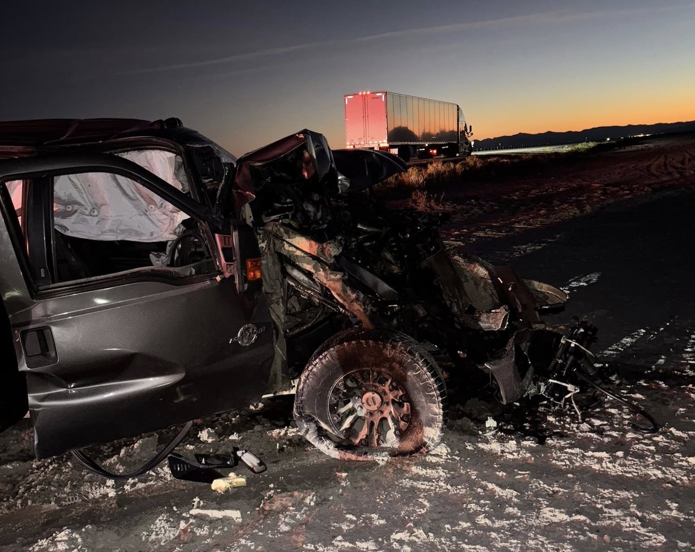 ‘MAJOR’ damage after car crashes into semi truck parked on I-80 shoulder