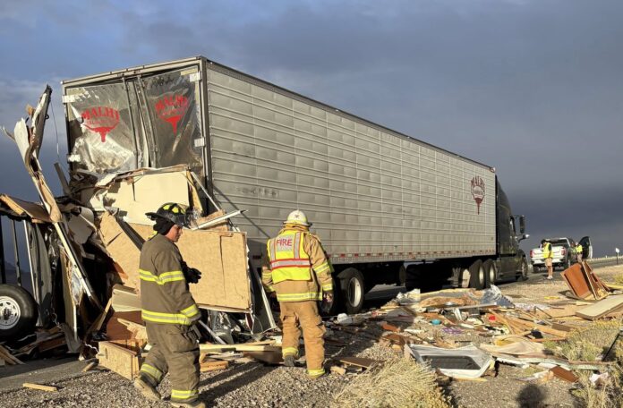 Powerful winds TOPPLE RV trailer, send it crashing into parked big rig on Utah interstate