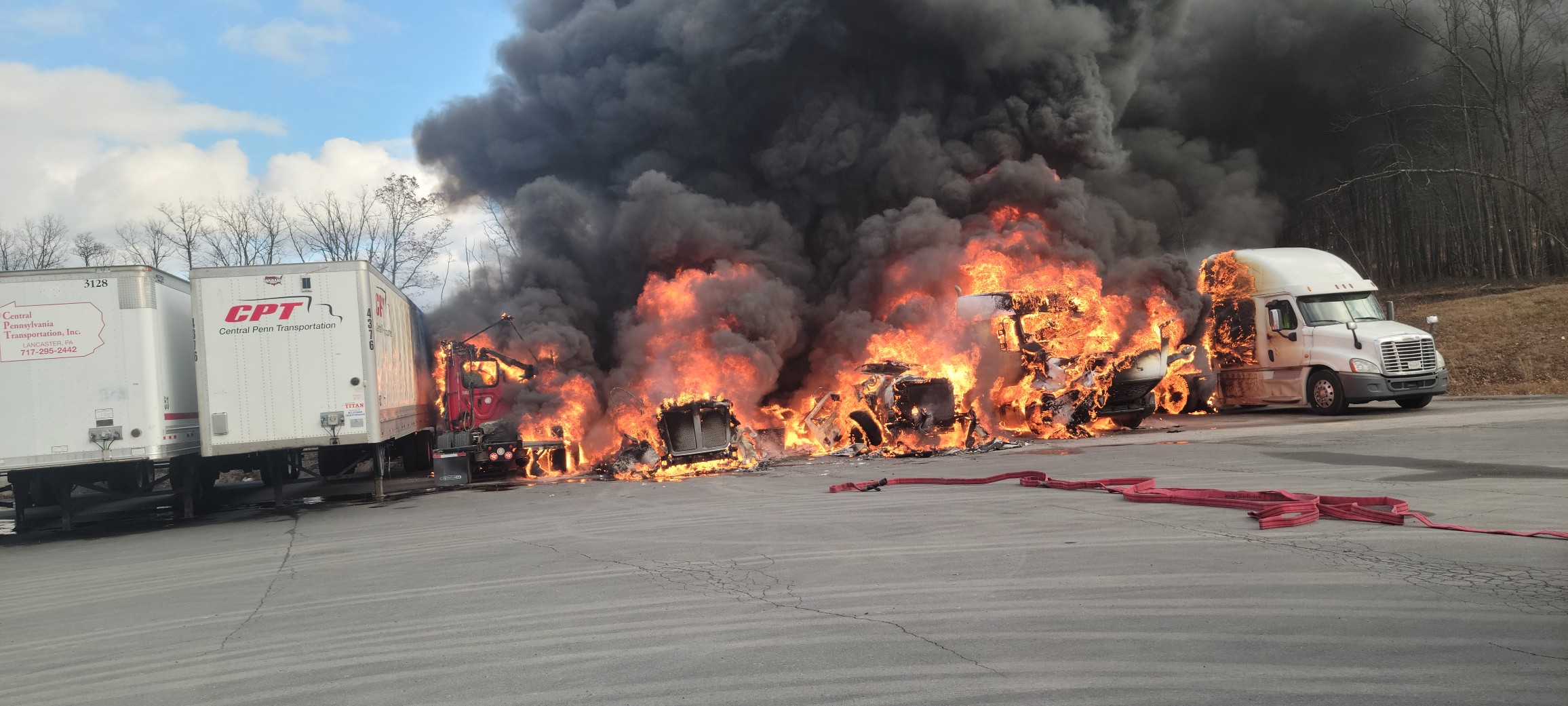 Pennsylvania firefighters say accident sparked fire that CHARRED multiple big rigs