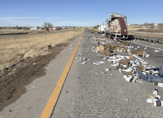 I-70 in Colorado STREWN with paper towels and tires after two semi truck crash