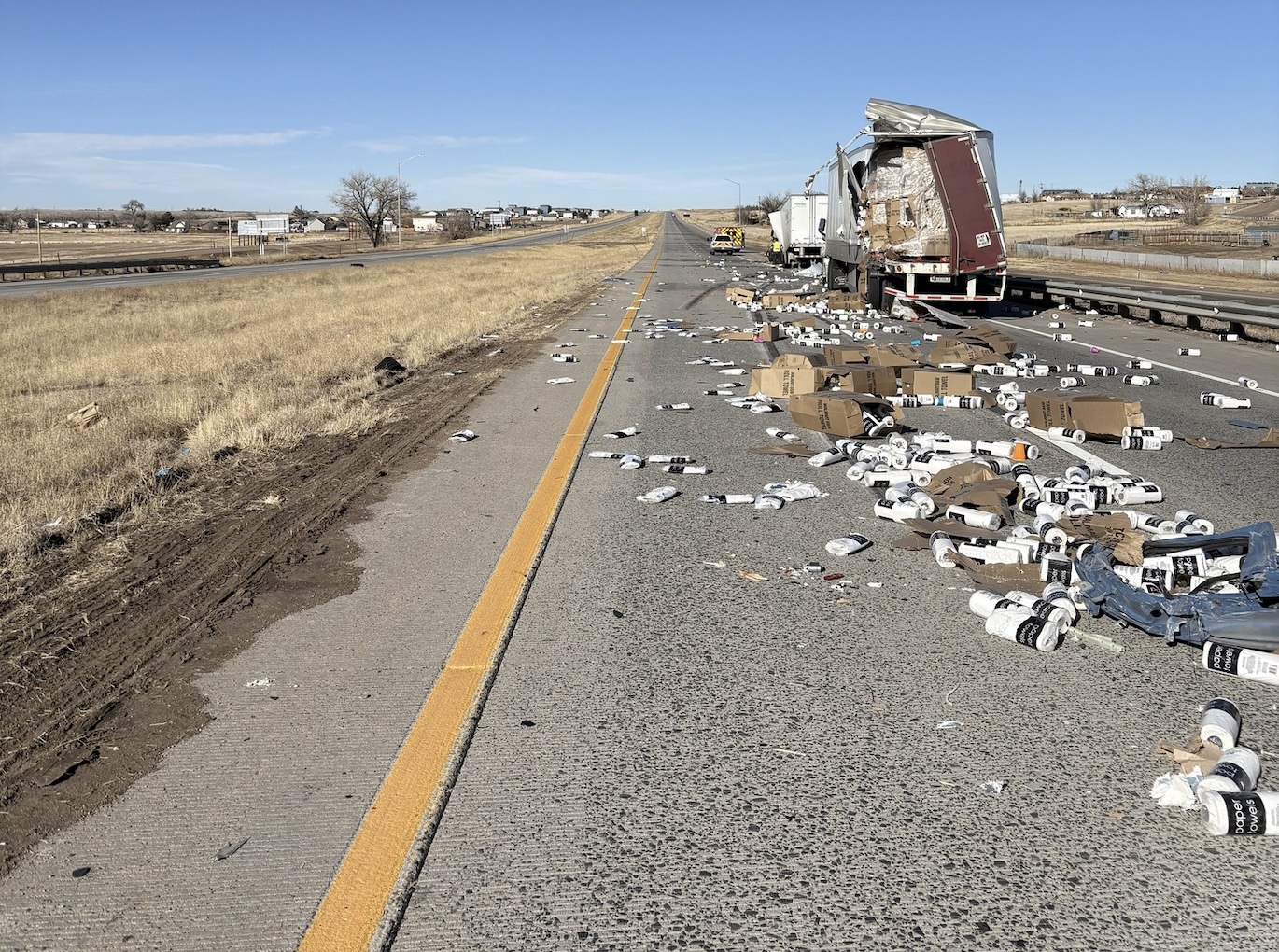 I-70 in Colorado STREWN with paper towels and tires after two semi truck crash
