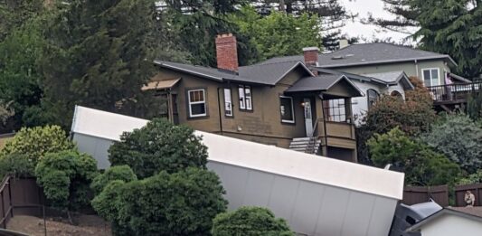 ‘Wrong turn’ sends semi truck crashing into cars, hydrant, and yard of California homeowner