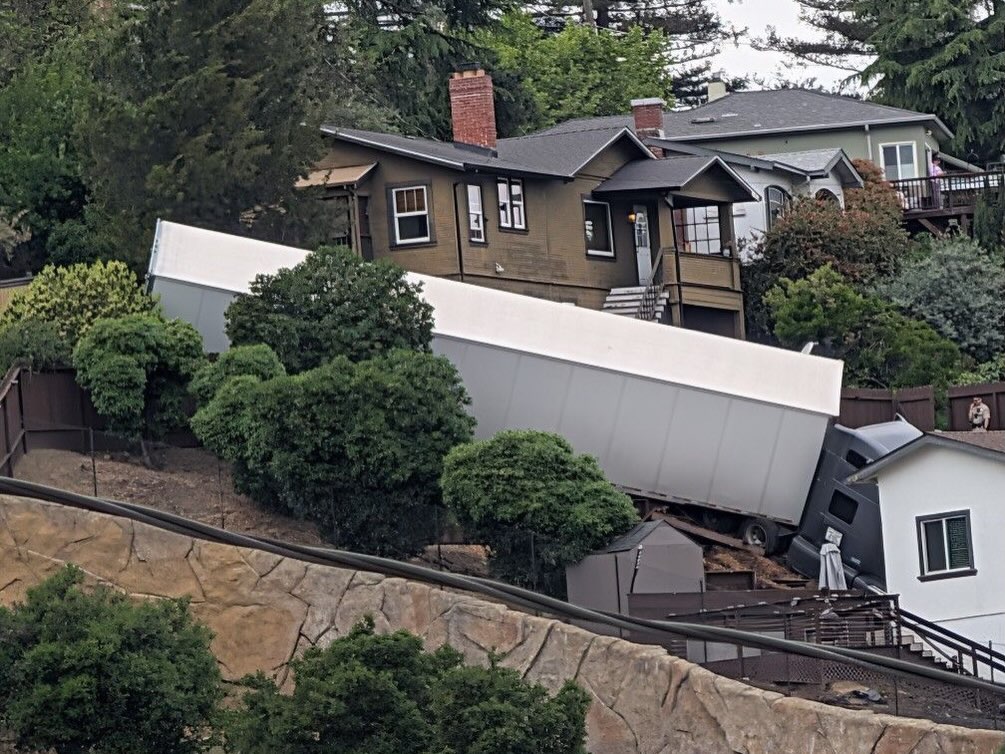 ‘Wrong turn’ sends semi truck crashing into cars, hydrant, and yard of California homeowner