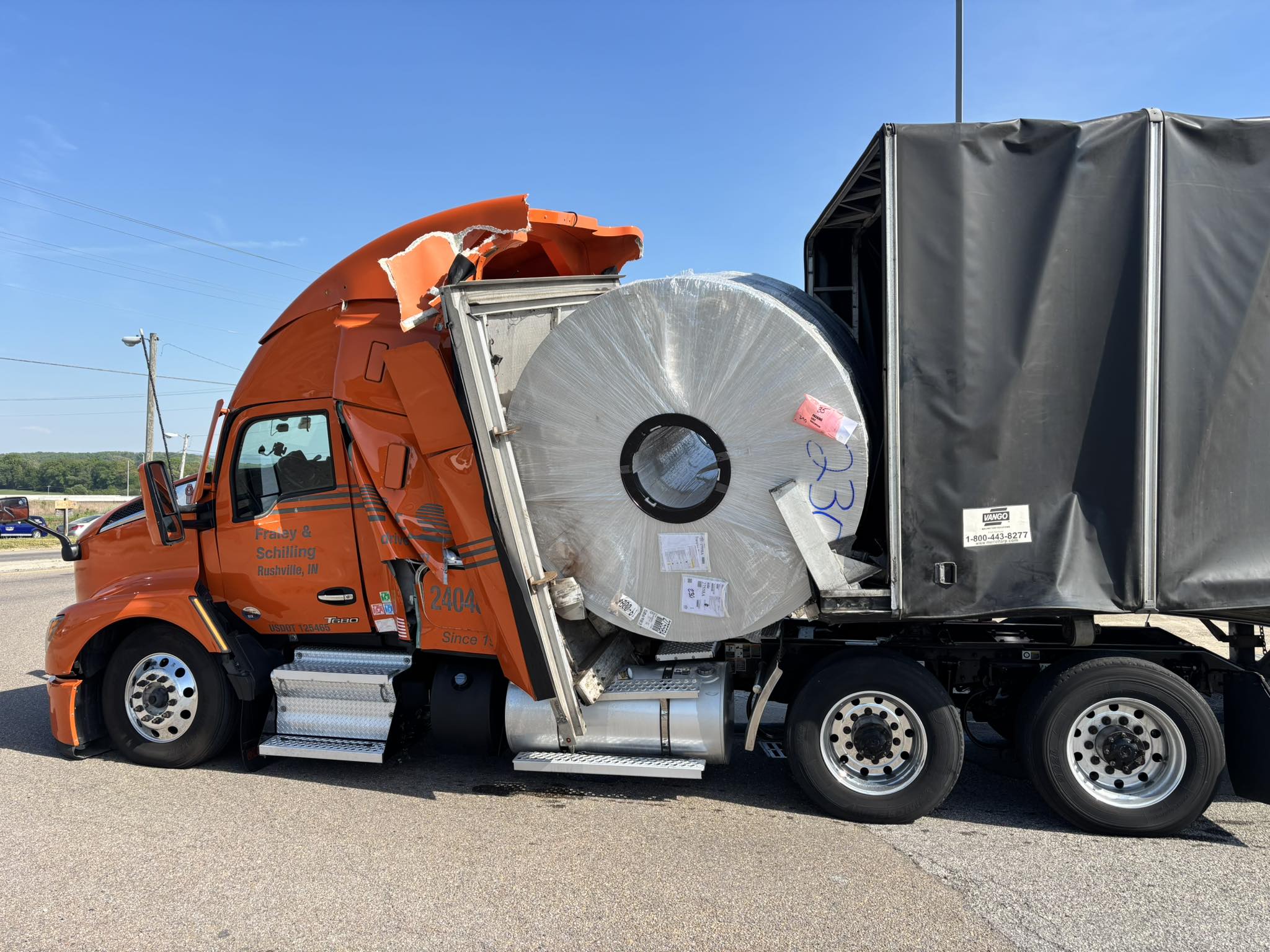 Truck driver survives after coil crashes into cab on Tennessee roadway