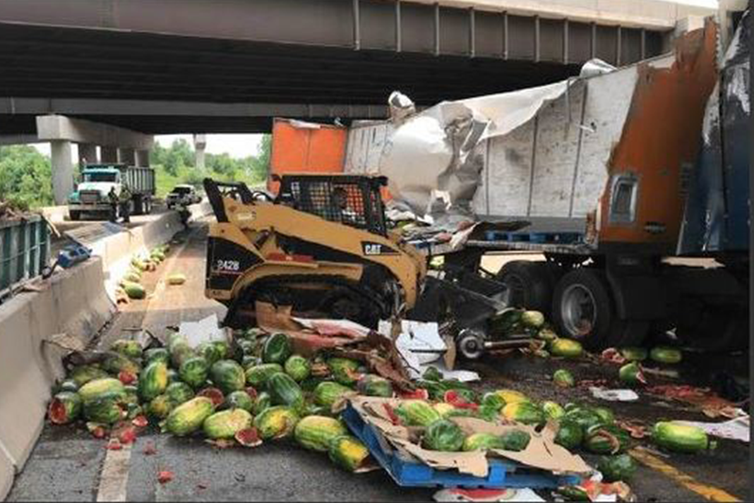 Overturned semi spills hundreds of watermelons all over a North Carolina interstate