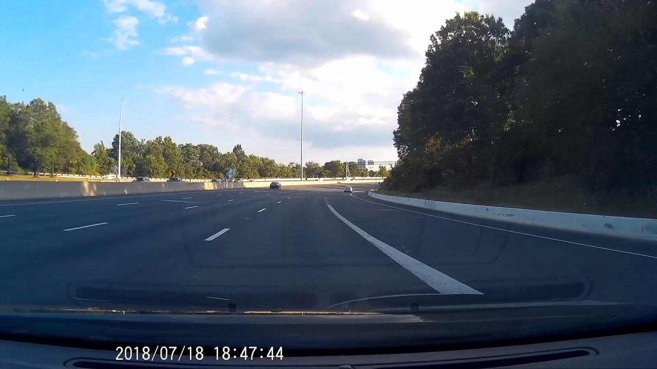 VIDEO: semi truck uses shoulder to pass motorist on wide-open highway