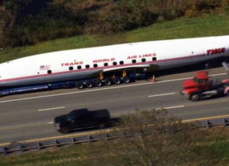 Plane-hauling big rig blows tire in-transit