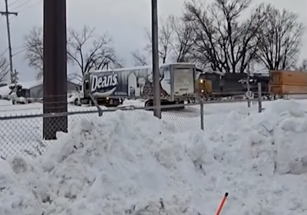 Video shows CSX train BLASTING through stuck semi trailer